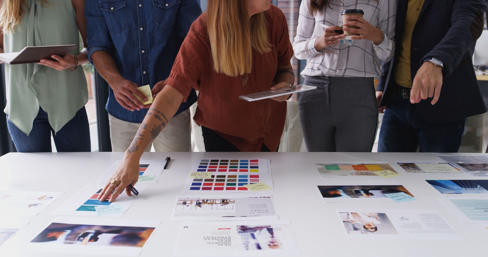 Creative, meeting and hands of business people with color palette for planning, web design and ideas. Collaboration, teamwork and workers with tablet, documents and layout for company website